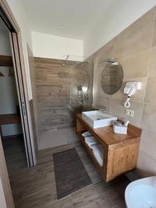 a bathroom with a sink and a shower at Why Not B&B in San Polo Matese