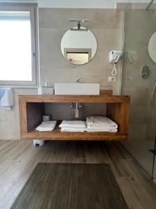 a bathroom with a sink and a mirror at Why Not B&B in San Polo Matese