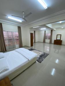 a large bedroom with a large bed in a room at AL KALDi in Salalah