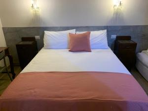 Postel nebo postele na pokoji v ubytování Guest House Vagamondo