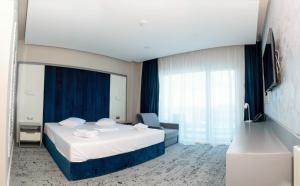 Un pat sau paturi într-o cameră la Hotel Union