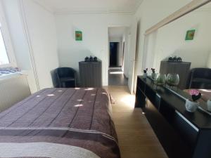 Postel nebo postele na pokoji v ubytování LE VIEUX MOULIN