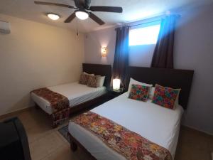 Postel nebo postele na pokoji v ubytování Hotel Balché + 37 fotografií