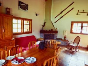 a living room with a table and a couch at Chalet Valfréjus, 5 pièces, 6 personnes - FR-1-468-39 in Valfréjus