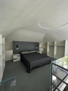 a bedroom with a large bed in a room with a glass at Villa Rosa in Ischia