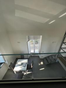 a room with a glass floor with a table and chairs at Villa Rosa in Ischia