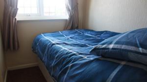 Кровать или кровати в номере Blackpoolholidaylets Salmesbury Avenue Families And Contractors only