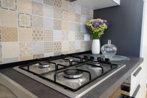 A kitchen or kitchenette at Chérie Apartment Tropea