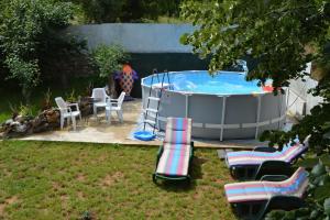 a group of chairs sitting next to a hot tub at Macedonia, Accommodations,rentals"Villa Vevcani" Vevchani in Vevčani