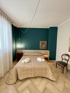 Posteľ alebo postele v izbe v ubytovaní 4 Balconi House-Elegante dimora nel centro storico