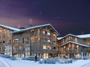 a large wooden building in the snow at night at Appartement Les Gets, 3 pièces, 6 personnes - FR-1-623-116 in Les Gets