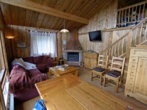 a living room with a couch and a table at Chalet Enchastrayes, 5 pièces, 10 personnes - FR-1-165A-20 in Enchastrayes