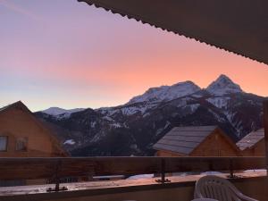 a view of the mountains from the balcony of a house at Appartement 2 Chambres, Garage, Pra-Loup 1500, WIFI - FR-1-165A-50 in Uvernet-Fours +3 photos