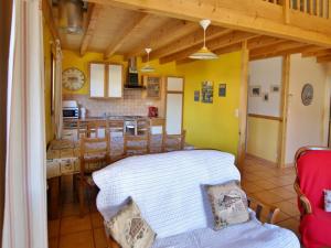 a living room with a bed and a kitchen at Maison Saint-Pons, 4 pièces, 8 personnes - FR-1-165A-91 in Saint-Pons