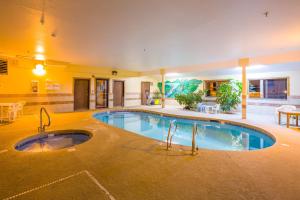 a large swimming pool in a hotel room at Alpine Inn & Suites Gunnison in Gunnison