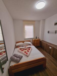 a bedroom with a bed and a mirror in it at Hostel BellaVista in Koper