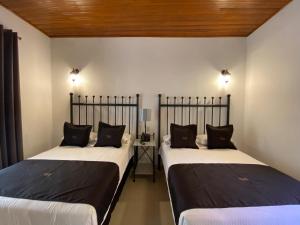 En eller flere senge i et værelse på Hotel Plata Condesa