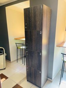 a wooden locker in a room with a table at Le Rêve city hostel in Odesa
