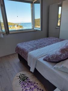 Postel nebo postele na pokoji v ubytování HOLIDAY HOME KATE