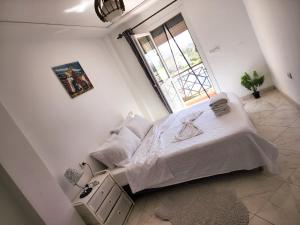 Кровать или кровати в номере FamilyConfort Saidia