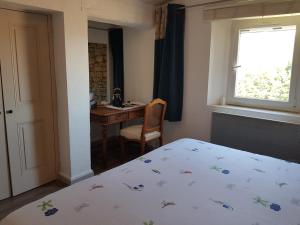 Postel nebo postele na pokoji v ubytování Chambre du sentier des ocres