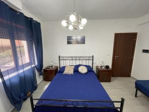 Postel nebo postele na pokoji v ubytování Donnabella house