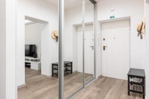 Televízia a/alebo spoločenská miestnosť v ubytovaní Top Location Apartment "Park"
