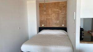 Кровать или кровати в номере Sea Shelter