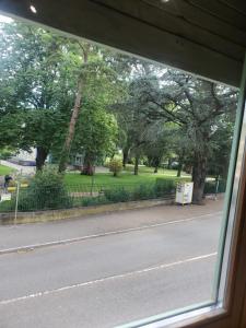 a view from a window of a street with trees at Appartement meublé aux portes de Genève in Annemasse