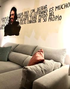 a man laying on a couch in a living room at ApARTment Madrid in Madrid