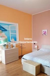 a bedroom with a bed and a table with a cake on it at Bed And Salerno - Largo Campo - Appartamento in Salerno