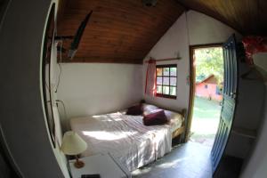 Ένα ή περισσότερα κρεβάτια σε δωμάτιο στο "Brilho do Sol"