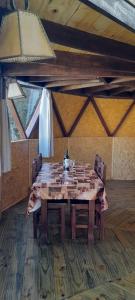 a large wooden table with chairs in a room at DOMO ¨EL TIO JUAN¨ in Piriápolis