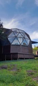 a building with a glass dome on top of a bench at DOMO ¨EL TIO JUAN¨ in Piriápolis +21 photos