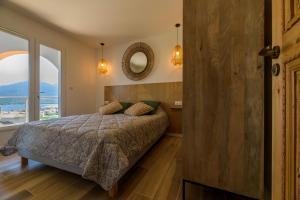 En eller flere senger på et rom på Résidence Ochji di Mare