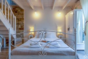 a bedroom with a metal bed in a room at Agroturystyka Corno Owca in Żabnica