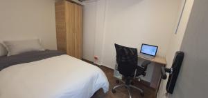 Postel nebo postele na pokoji v ubytování Portal Norte 170 ACOGEDORAS HABITACIONES CON TODOS LOS SERVICIOS