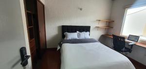 Postel nebo postele na pokoji v ubytování Portal Norte 170 ACOGEDORAS HABITACIONES CON TODOS LOS SERVICIOS