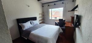 Postel nebo postele na pokoji v ubytování Portal Norte 170 ACOGEDORAS HABITACIONES CON TODOS LOS SERVICIOS