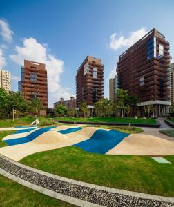 a skate park in the city with tall buildings at Green Court Premier Jinqiao Shanghai in Shanghai