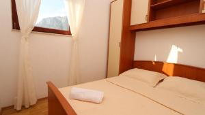 Postel nebo postele na pokoji v ubytování Mamma Mia Apartments