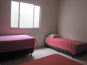 เตียงในห้องที่ EcoRupestre Hostel & Receptivo