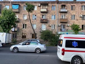 a silver car parked in front of a building at Apartment near Airport and station Charbakh in Yerevan