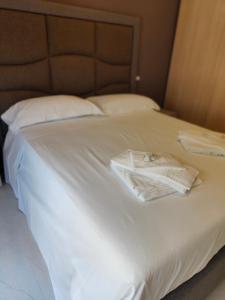 A bed or beds in a room at Fantasia B&B APARTAMENT STUDIO