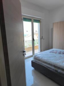 A bed or beds in a room at Fantasia B&B APARTAMENT STUDIO