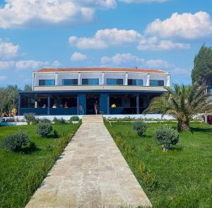 a building with a walkway in front of it at The Kirte Hotel V Beach 