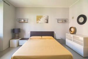 Кровать или кровати в номере La Fabbrica dei Sogni
