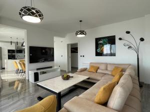 a living room with a couch and a table at Villa Pine in Bar