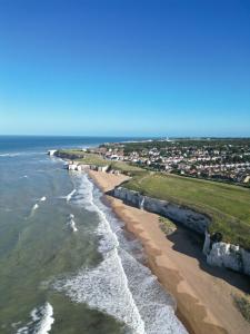 an aerial view of the shoreline of a beach at Summer House at Percy Villas in Kent