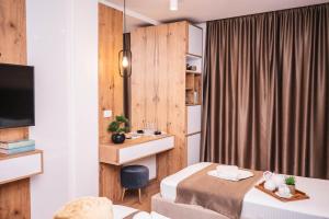 Postel nebo postele na pokoji v ubytování Apartments Cungu